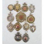 A group of thirteen silver Victorian pocket watch fobs, 3.15toz.