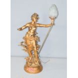 A large table lamp in the form of a woman holding torch with flame. 100cm high.