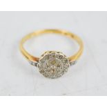 An 18ct gold and diamond cluster ring, size P, 2.9g.