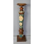 A Victorian ceramic and mahogany jardinere stand, 112c, high.