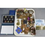 A selection of British and worldwide coins and uncirculated coins, some silver examples.