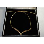 A 9k gold necklace and bracelet set, in yellow, rose and white gold segments, 26.3g.