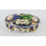 A 19th century Sevres trinket box, with blue ground and gilded highlights, and a berry form