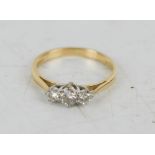 An 18ct gold three stone diamond ring, 1.8g.