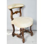 A French walnut side chair, with cream upholstered top rail and seat.