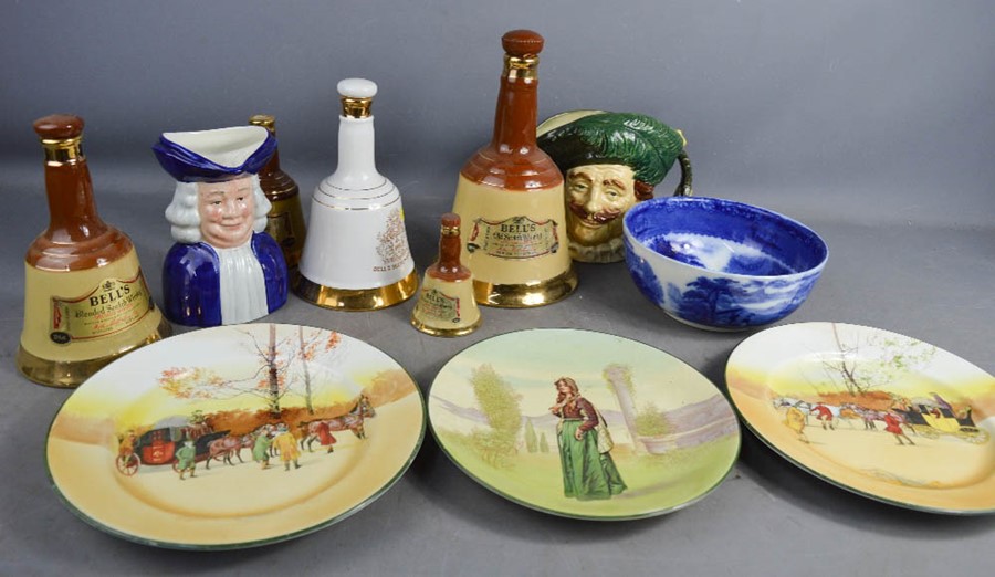 A Royal Doulton Toby jug, a group of empty Bells Whisky decanters, a Jenny Lind bowl and Royal