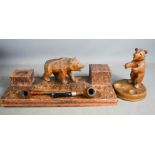 An antique Blackforest bear inkwell, and a pipe stand, both carved in the form of bears.