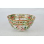 A 19th century Canton rice bowl, decorated with figural scenes, 12cm diameter.