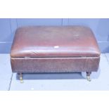 A large leather lidded footstool / ottoman