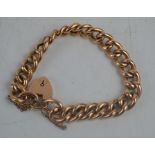 A 9ct gold chain link bracelet with heart form clasp and safety chain, 16.3g.