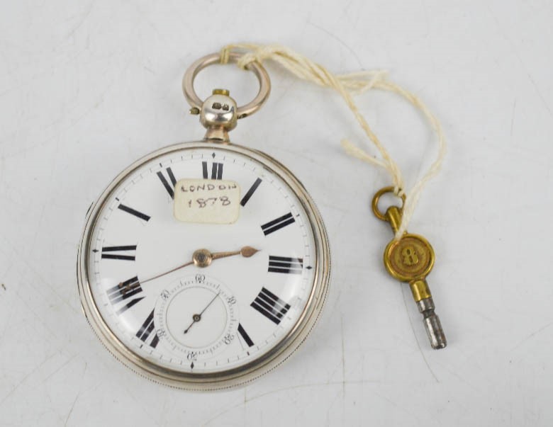 A silver 19th century pocket watch, London 1878, with white enamel face, and inset seconds dial,