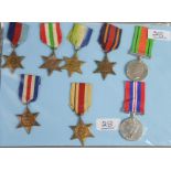 A group of eight various WWII medals.