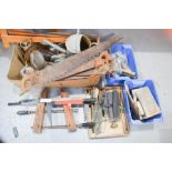 A selection of hand tools, saws and spanners etc.