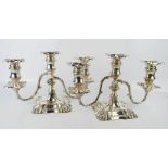 A pair of silver candelabra by William Hutton & Sons Ltd, Sheffield 1960, with removable candle
