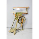 An antique hobbies pedal powered Pret Jig saw and box of tools.