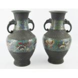 A pair of antique Chinese champleve vases, with twin elephant form handles, 27cm high.