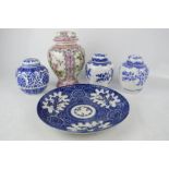 A group of blue and white Chinese ginger jars, dish and vase with cover and pink ground.