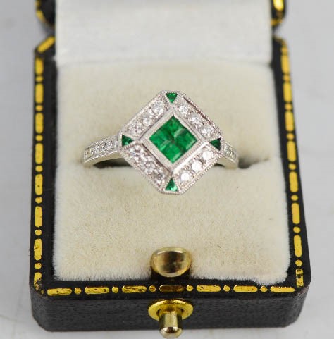 An 18ct white gold, emerald and diamond Art Deco style ring, with four brilliant cut emeralds, - Image 2 of 3