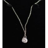 An 18ct white gold and diamond pendant necklace, the ½ct diamond on a 'floating'/slider pendant.