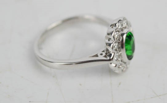 An 18ct white gold and Tsavorite garnet and diamond ring, of flowerhead form, with approx 1ct - Image 3 of 3