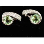 A pair of 18ct white golf and green tourmaline and diamond earrings, with stud back, 10.1g.