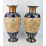 A pair of Doulton stoneware vases, (matched pair), impressed to the base 4100, 44cm high.