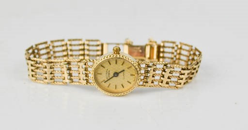 A 9ct gold Rotary ladies wristwatch, with a gate form strap, 14.4g total.