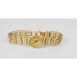 A 9ct gold Rotary ladies wristwatch, with a gate form strap, 14.4g total.