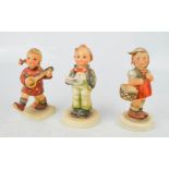 Three Hummel Goebel figures.