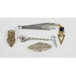 A silver Art Nouveau style brooch, Art Deco pendants and other examples.