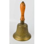 A brass Fiddian bell with wooden handle.