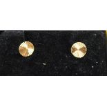 A pair of 9ct gold stud earrings.