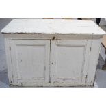 A white painted antique pine cupboard. A/F 87cm x 130 x 49
