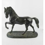 A plasterwork bronzed model horse, 39cm high.