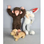 A mechanical bugs bunny, monkey and mechanical toy dog.