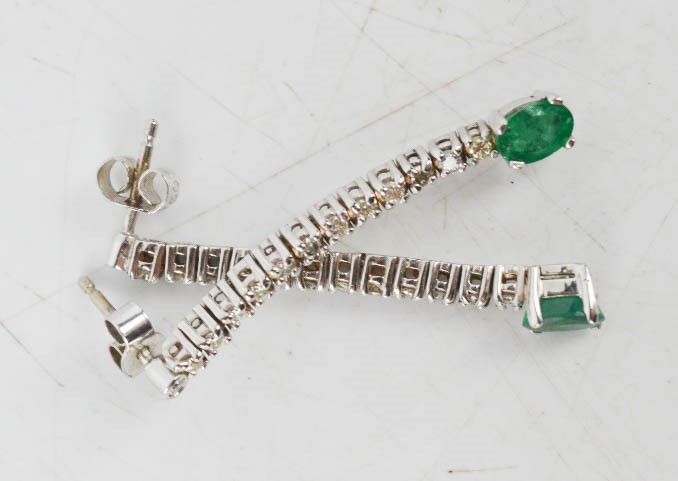 A pair of 18ct white gold, diamond and emerald drop earrings, 5.4g.