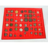 A Lindner tray containing 48 jetons, tokens, Roman Bronze and weights including Stamford 17th