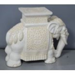 A ceramic garden seat in the form of an elephant. 37cm