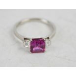 A platinum, pink sapphire and diamond ring, the square cut pink sapphire approximately 1.2ct,