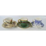 Three coffee cans and saucers: Japanese enamelled example depicting dragon, Wedgwood blue and white,