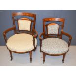 A pair of 19th century marquetry inlaid armchairs upholstered in Linwood, two different fabric