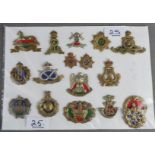 A group of fifteen military cap badges, and two collar dogs.