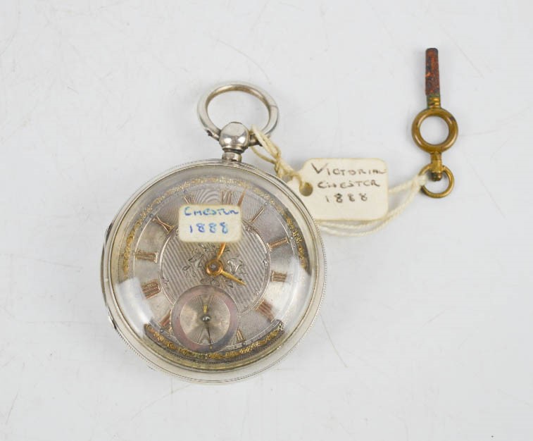 A silver 19th century open faced pocket watch, Chester 1888, silver engine turned face, with inset