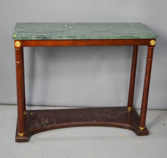 A marble top pier table with column form legs. 72 x 88 x 35