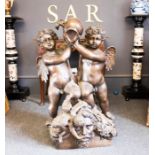 A 20th century garden bronze fountain figure group, modelled with two cherubs holding an urn, 94cm