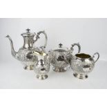 A silver plated tea set, early 19th century, with gilt interiors, comprising milk, slop bowl, teapot