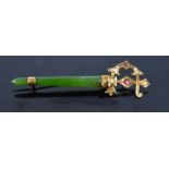 A 9ct gold, pearl and nephrite sword brooch.