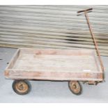 A vintage Slingsby wooden trolley with iron handle.