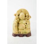 A soapstone carved Buddha, 20th century, 18cm high.