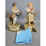 Two Capo di Monte porcelain figures.